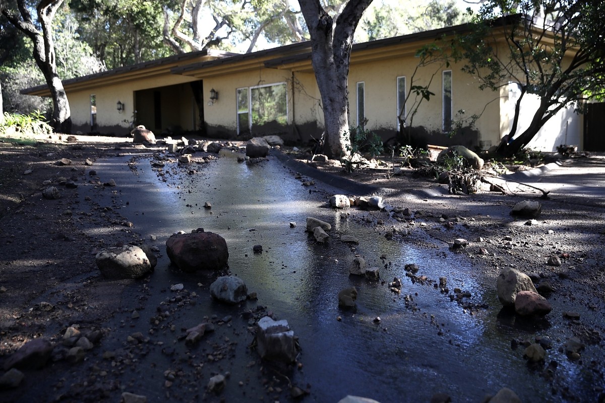 Debris from a mudslide sits in the driveway of a home on January 10, 2018 in Montecito, California. California wildfire