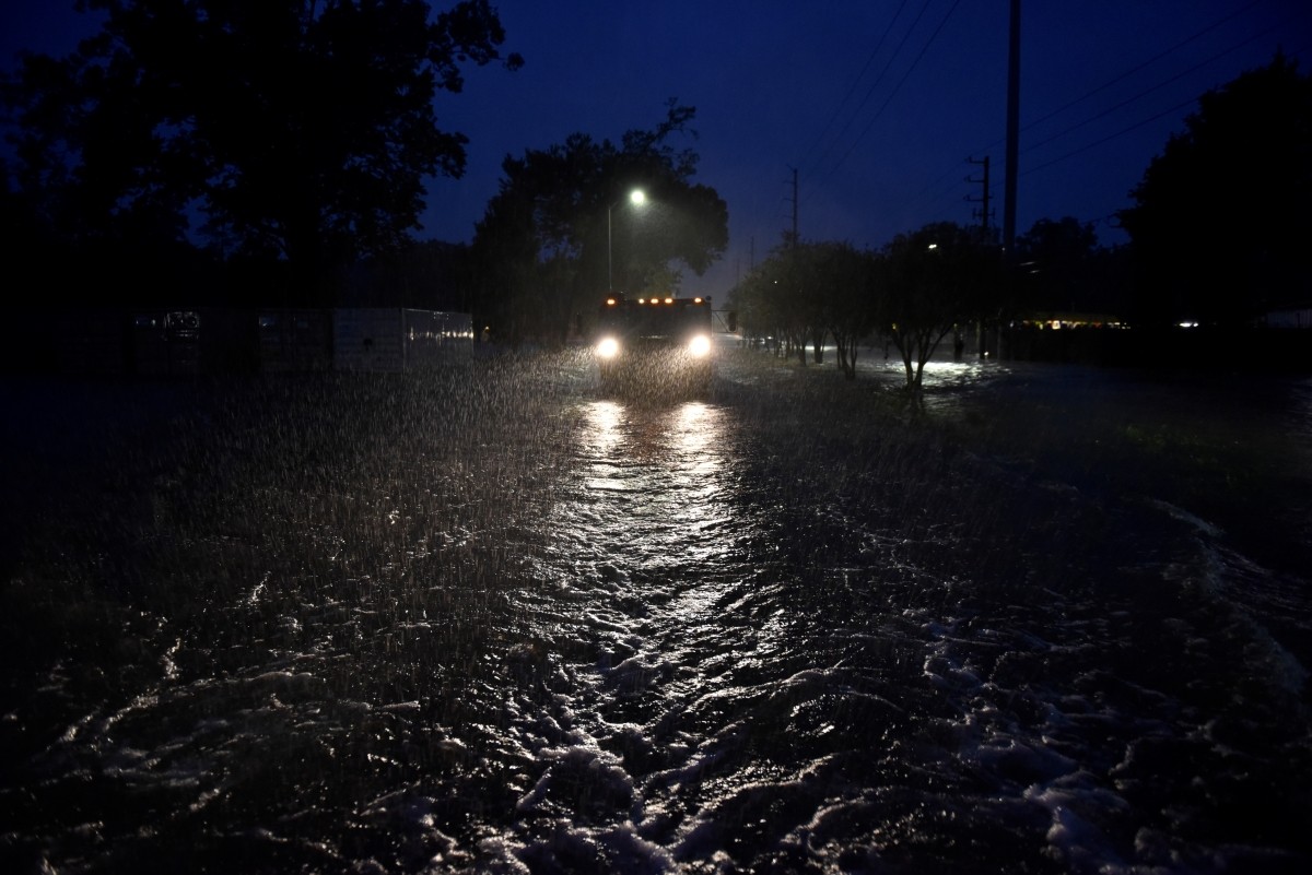 A civilian owned military vehicle drives through floodwaters performing search and rescue after Hurricane Harvey inundated the Texas Gulf coast with rain causing widespread flooding, in Houston Houston floods