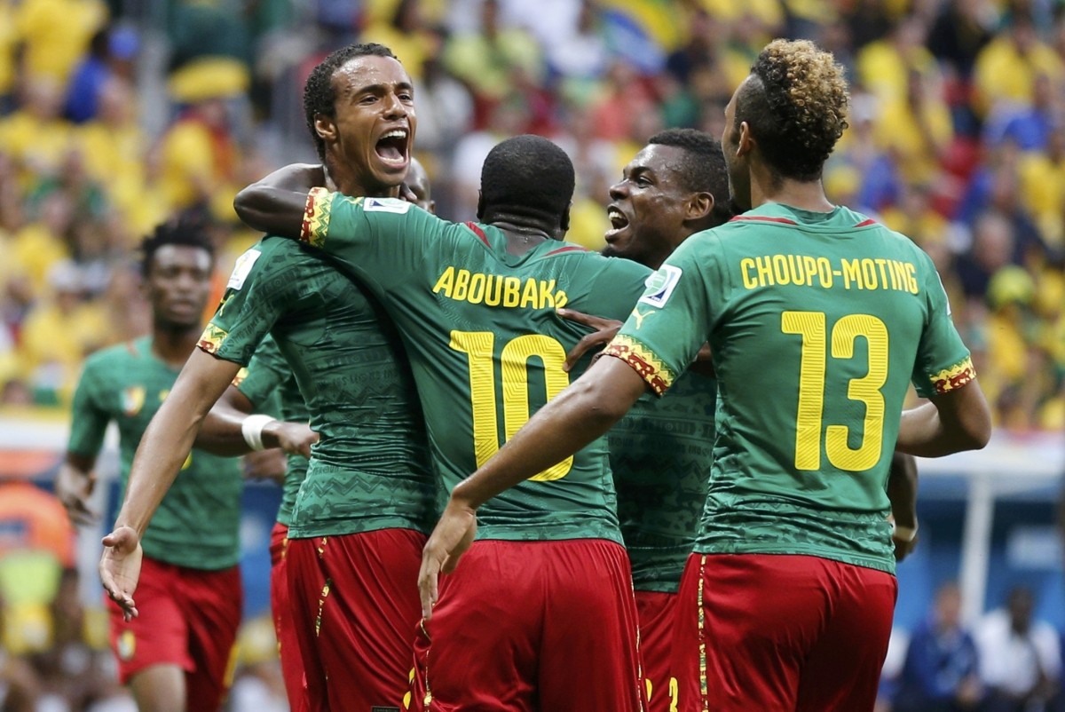 Cameroon's Matip celebrates his goal against Brazil with his teammates during their 2014 World Cup Group A match at the Brasilia national stadium in Brasilia Cameroon v Brazil