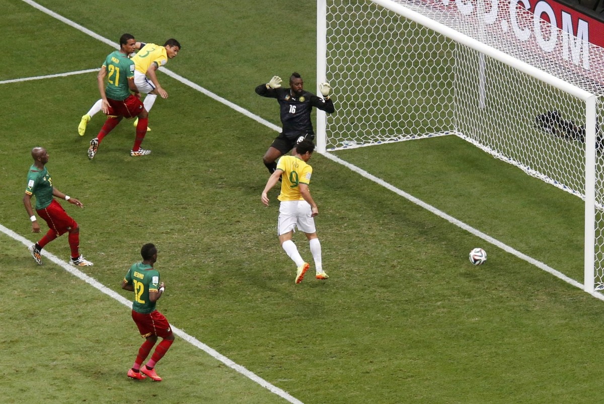 Brazil's Fred scores past Cameroon's goalkeeper Charles Itandje during their 2014 World Cup Group A match at the Brasilia national stadium in Brasilia Cameroon v Brazil