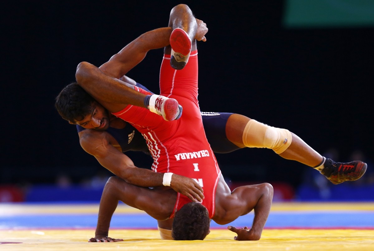 Yogeshwar Dutt thrashed his Canadian opponent in the final of 65 kg freestyle to clinch gold for India in wrestling. Yogeshwar Dutt