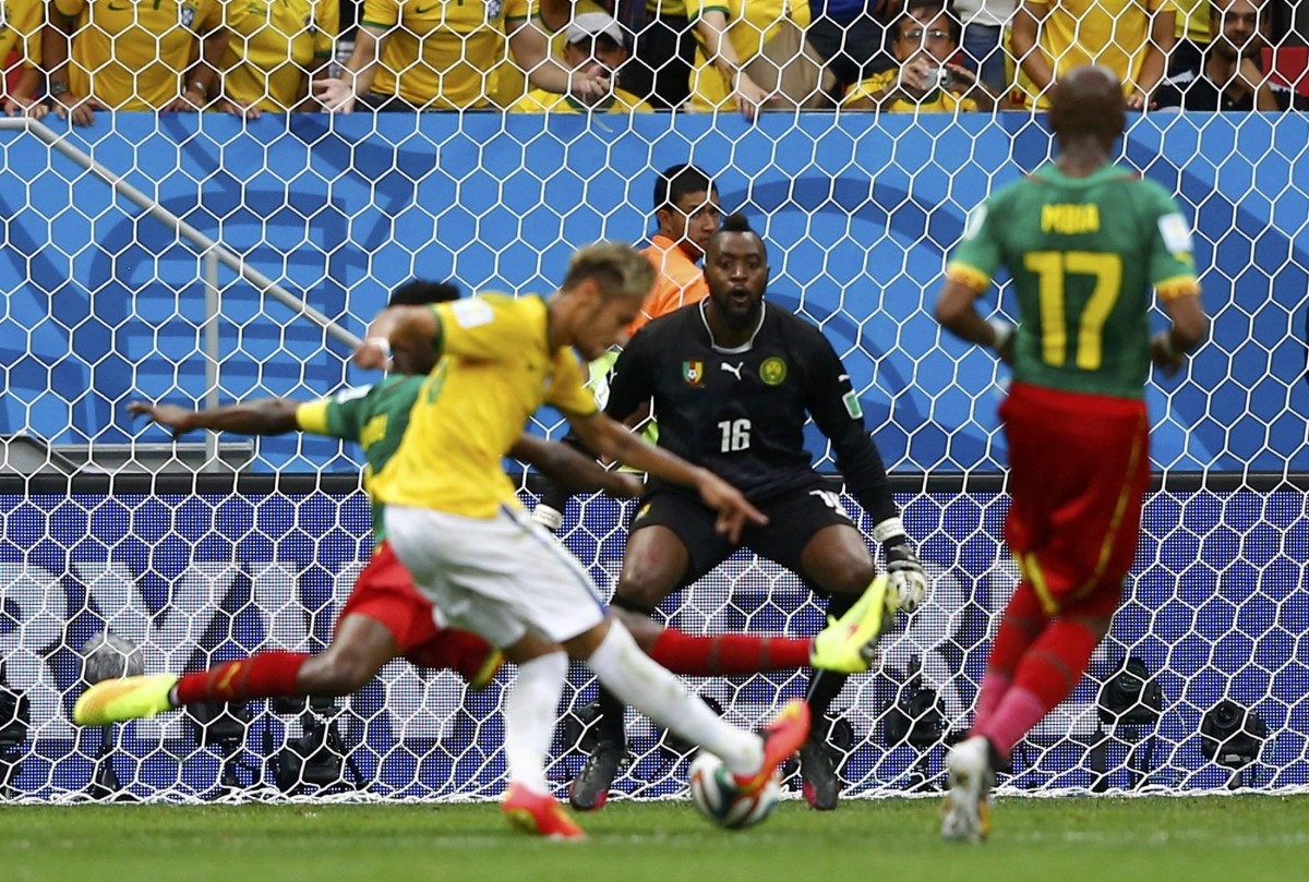 Brazil's Neymar scores his second goal during the 2014 World Cup Group A match between Cameroon and Brazil at the Brasilia national stadium Cameroon v Brazil