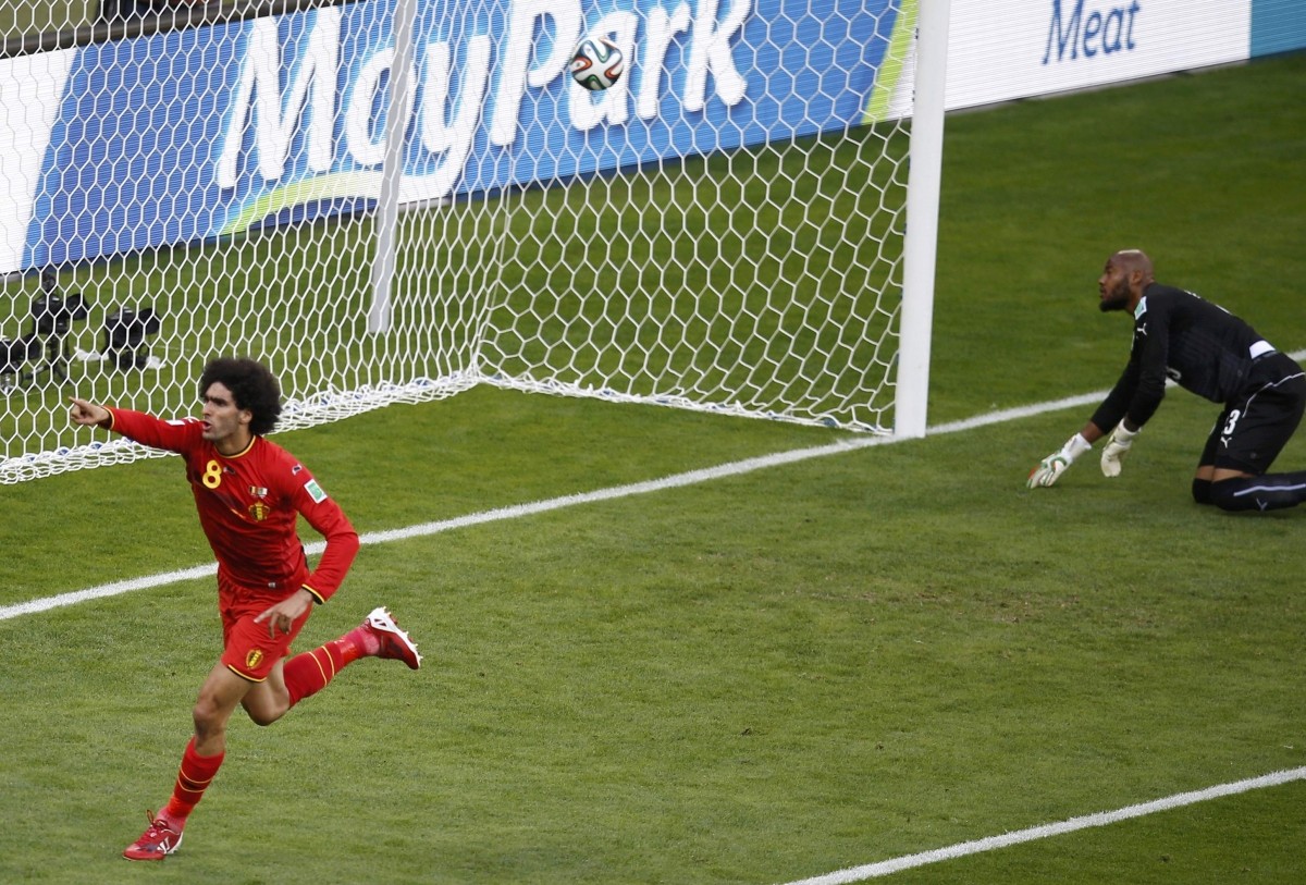Belgium's Fellaini scores a goal next to Algeria's Halliche during their 2014 World Cup Group H soccer match at the Mineirao stadium in Belo Horizonte Belgium v Algeria
