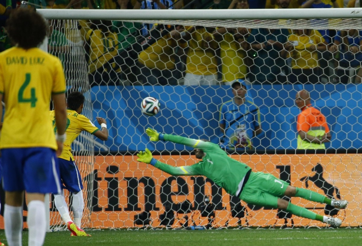 Brazil's Neymar scores a penalty as Croatia's Stipe Pletikosa tries to save it during the 2014 World Cup opening match between Brazil and Croatia at the Corinthians arena in Sao Paulo Brazil v Croatia