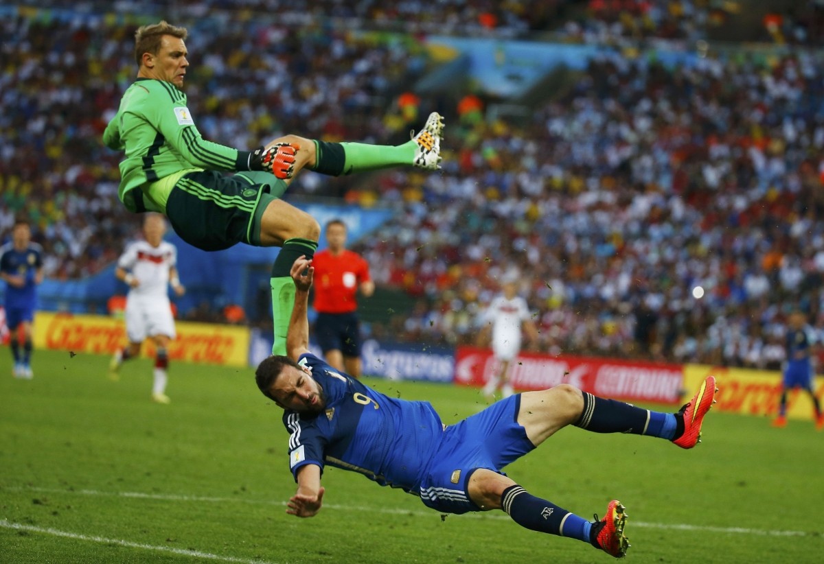 Argentina's Higuain fouls Germany's goalkeeper Neuer during 2014 World Cup final at the Maracana stadium in Rio de Janeiro. Germany vs Argentina
