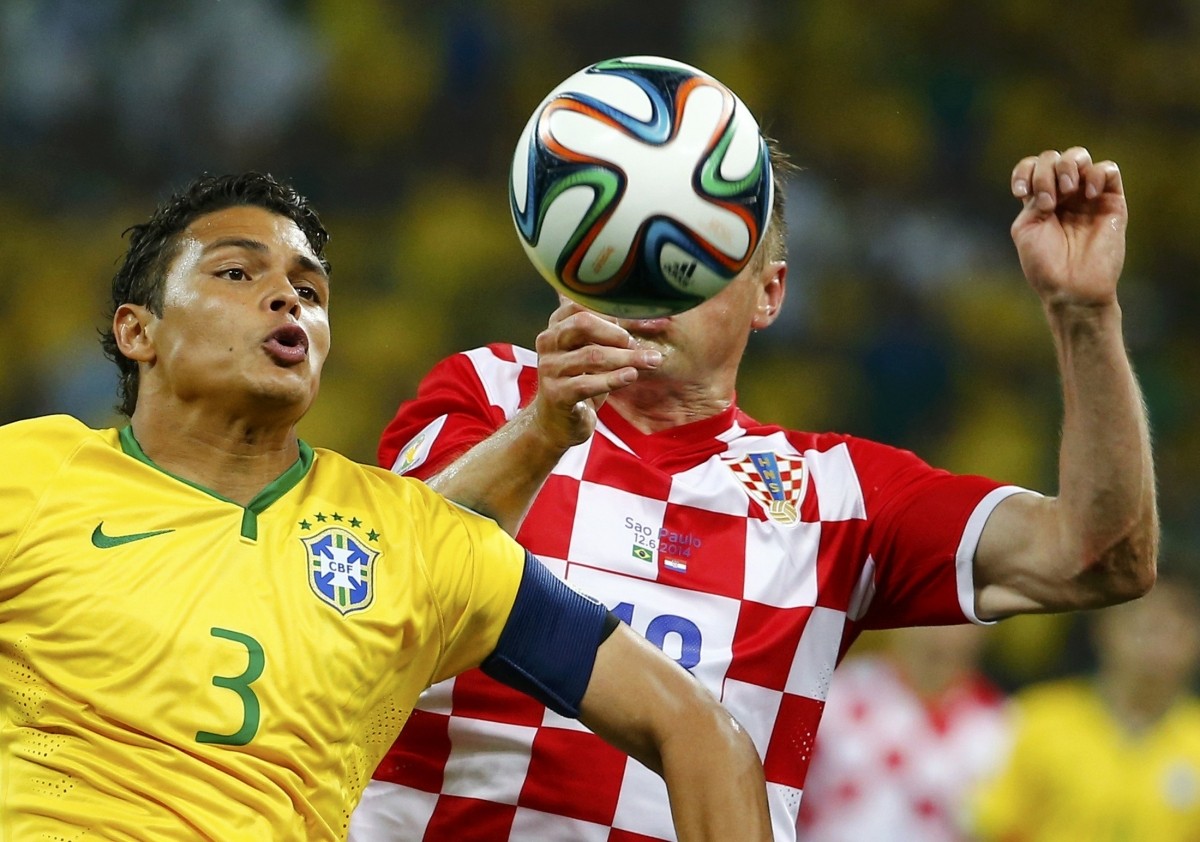 Brazil's Thiago Silva challenges Croatia's Ivica Olic for the ball Brazil v Croatia