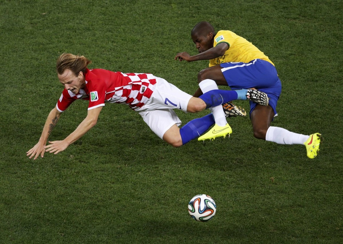 Croatia's Ivan Rakitic and Brazil's Ramires fight for the ball Brazil v Croatia