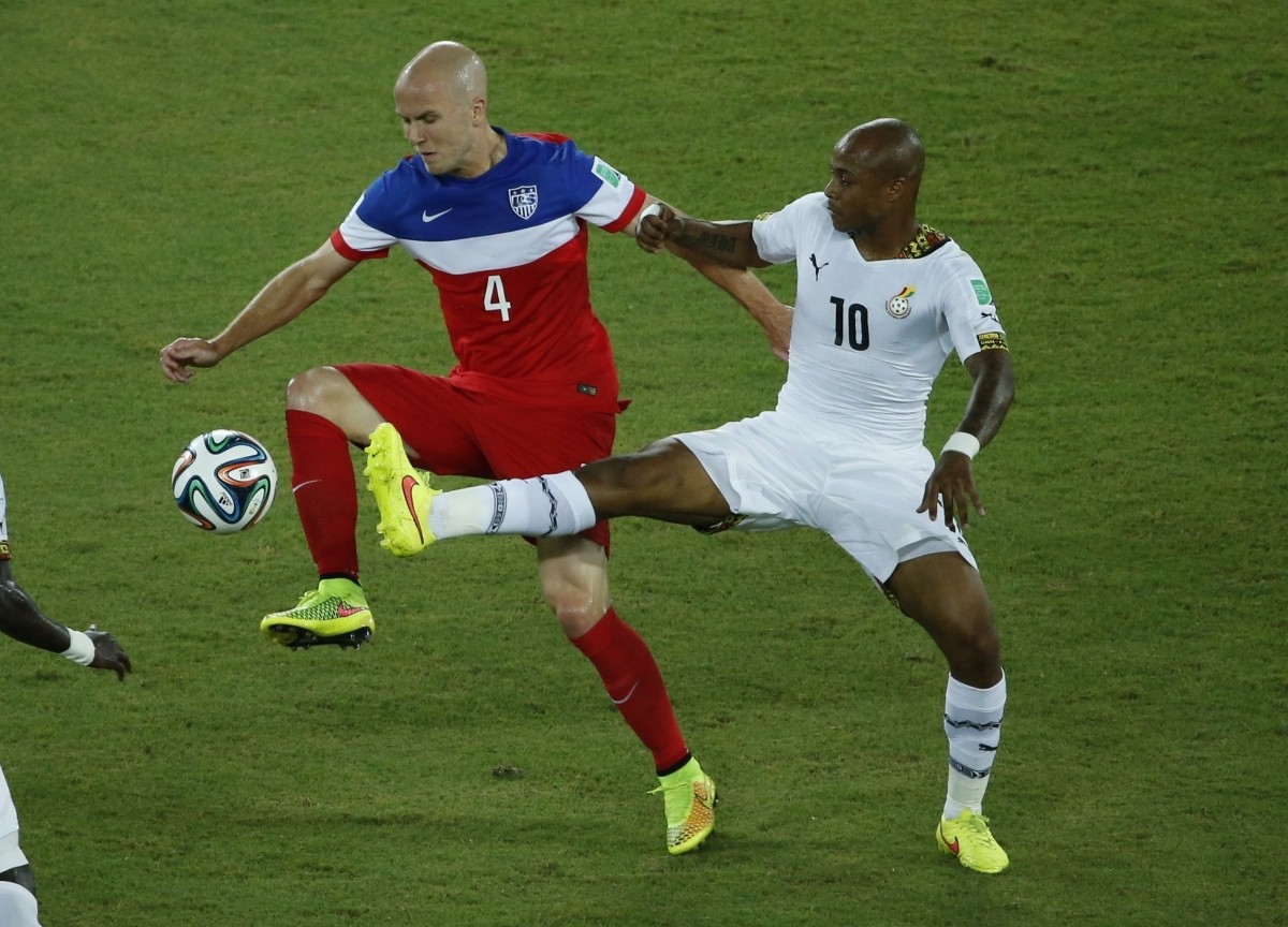 Bradley of the U.S. fights for the ball with Ghana's Ayew during their 2014 World Cup Group G soccer match at the Dunas arena in Natal Ghana vs USA