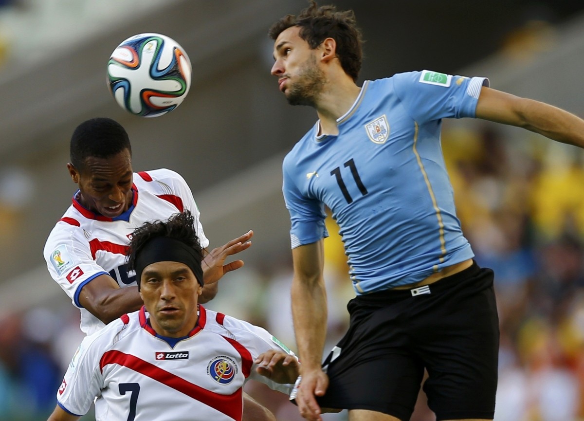 Costa Rica's Junior Diaz and Christian Bolanos fight for the ball Uruguay v Costa Rica