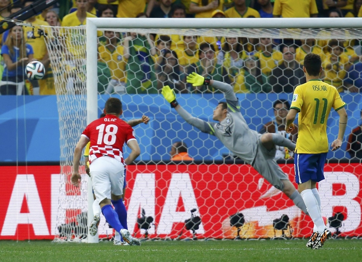 Brazil's Cesar jumps as he tries to save a ball Brazil v Croatia