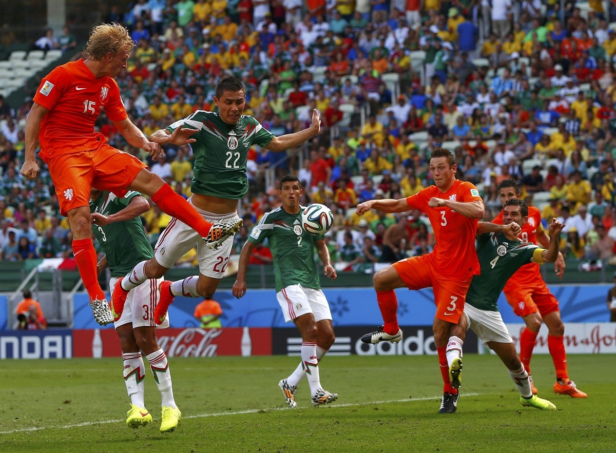 Kuyt and de Vrij of the Netherlands miss a goal opportunity during their 2014 World Cup round of 16 game against Mexico at the Castelao arena in Fortaleza Netherlands vs Mexico