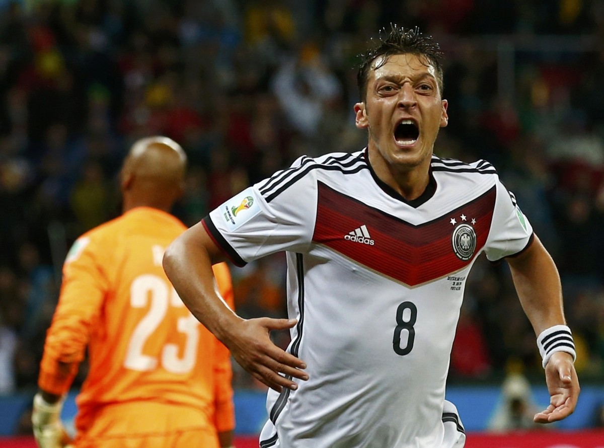 Germany's Ozil celebrates scoring a goal against Algeria during extra time in their 2014 World Cup round of 16 game at the Beira Rio stadium in Porto Alegre Germany vs Algeria