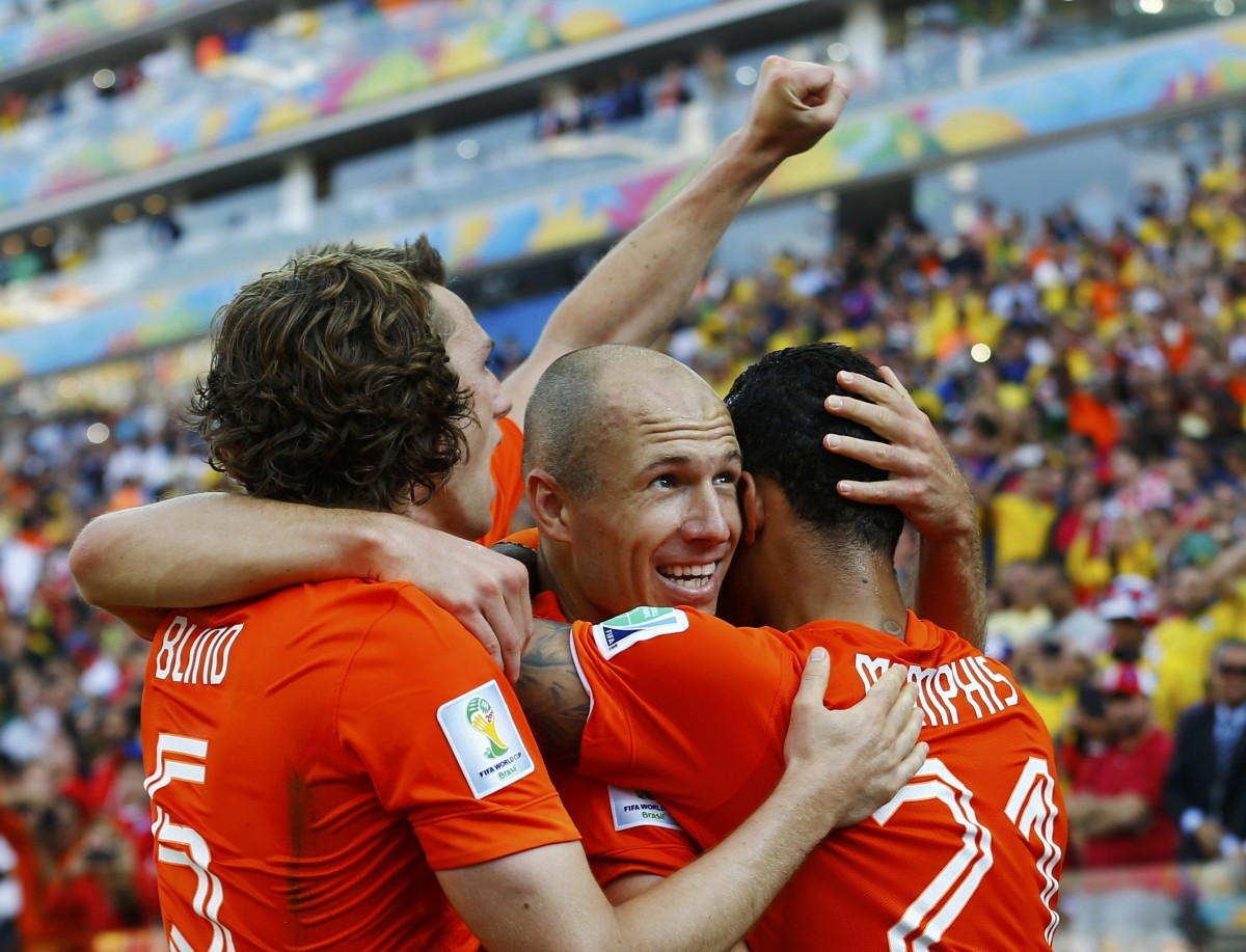 Depay of the Netherlands celebrates after scoring a goal with teammates Robben and Blind during their 2014 World Cup Group B match against Chile at the Corinthians arena in Sao Paulo Netherlands v Chile