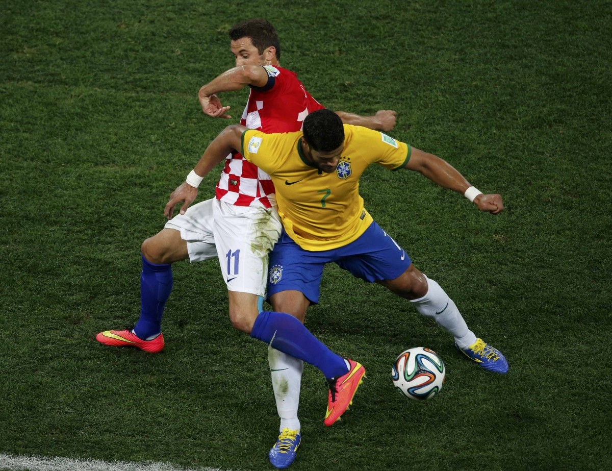 Croatia's Darijo Srna fights for the ball with Brazil's Hulk Brazil v Croatia