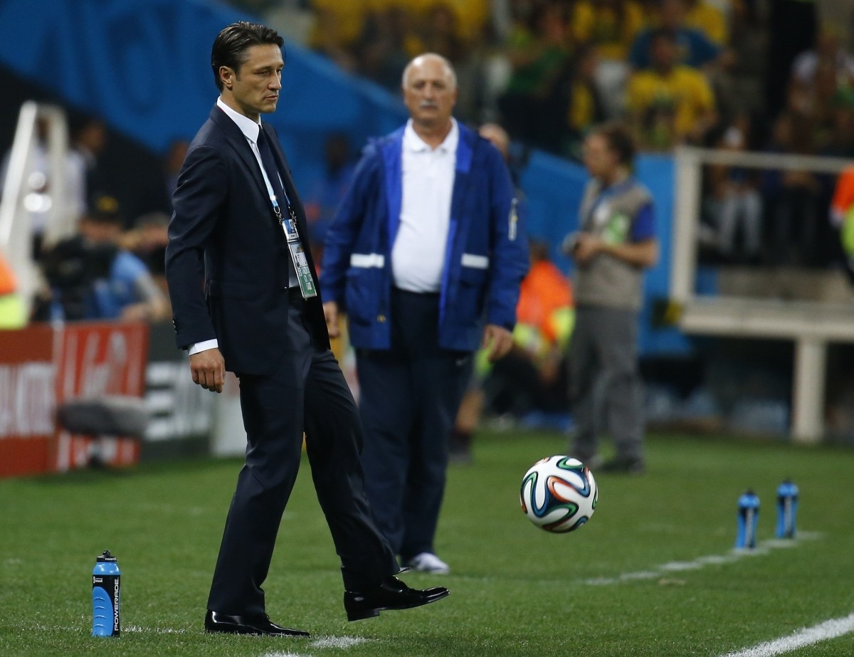 Croatia's coach Niko Kovac (L) kicks a soccer ball as Brazil's coach Luiz Felipe Scolari looks on Brazil v Croatia
