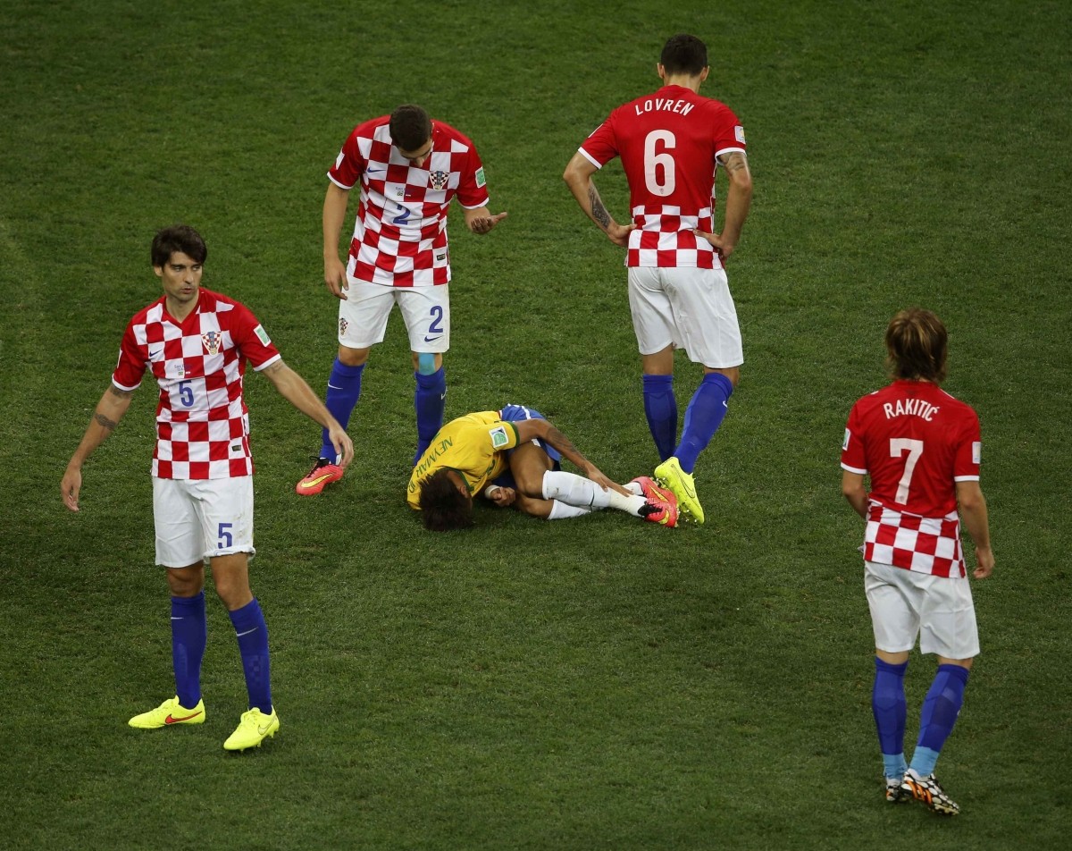 Brazil's Neymar lies on the pitch after being fouled by Croatia's Corluka Brazil v Croatia