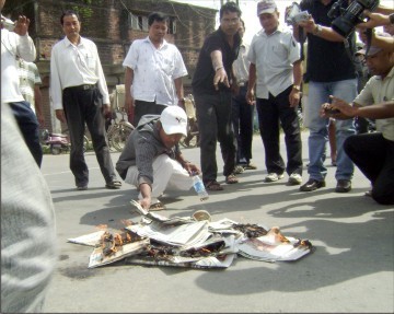 Members of Apunba Lup burns The Telegraph copies in protest against a report on the personal life of human rights icon Irom Sharmila Chanu who has been fast for the last 10 years. Burning of The Telegraph copies