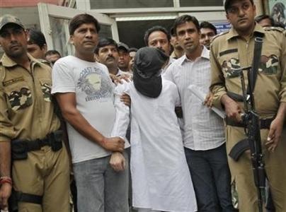 Sayeed Zabiuddin Ansari, with his face covered, leaves from a hospital in New Delhi June 29, 2012. REUTERS/Adnan Abidi Sayeed Zabiuddin Ansari