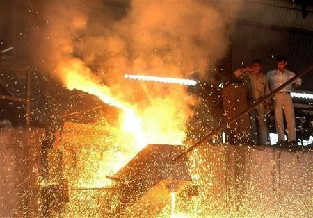 Labourers work inside a factory on the outskirts of Agartala, March 28, 2007.
