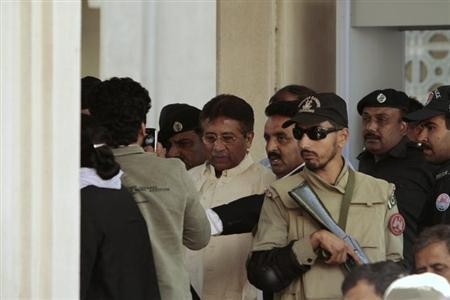Pakistan's former President Pervez Musharraf (C) leaves after his appearance before the High Court in Rawalpindi April 17, 2013.