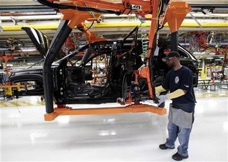 Chrysler auto assembly worker Michael Ricks works on the assembly line attaching doors to the all-new 2011 Jeep Cherokee's at the Jefferson North Assembly Plant in Detroit,