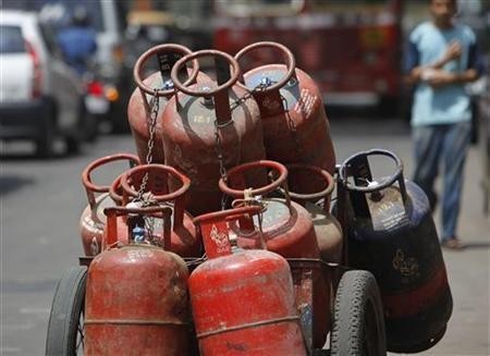A man walks past gas cylinders loaded on a cart in Mumbai (Representational Picture, Reuters)