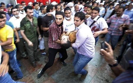 Members of the Muslim Brotherhood take cover in Cairo, Egypt Members of the Muslim Brotherhood take cover in Cairo