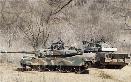 South Korean soldiers from an artillery unit participate in a military drill near the demilitarised zone separating North Korea from the South, in Paju, north of Seoul March 29, 2013. South Korean soldiers from an artillery unit participate in a military drill near the demilitarised zone separating North Korea from the South, in Paju, north of Seoul March 29, 2013.