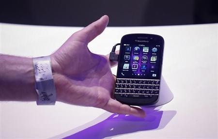 An attendee reaches out to grab a newly launched Research in Motion (RIM) Blackberry 10 device in New York January 30, 2013. An attendee reaches out to grab a newly launched Research in Motion (RIM) Blackberry 10 device in New York January 30, 2013.