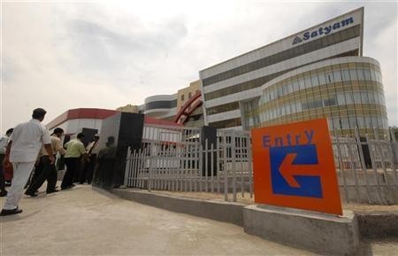 Employees of Satyam Computer Services Ltd., enter their head office in Hyderabad. Satyam Computer Services Ltd