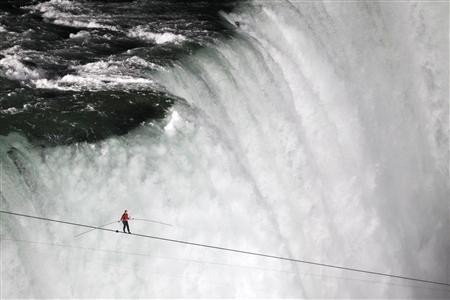 Nik Wallenda, has made a historic tightrope crossing over roaring Niagara Falls on Friday night (Reuters) Nik Wallenda, has made a historic tightrope crossing over roaring Niagara Falls on Friday night