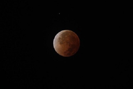 The moon is seen during a total lunar eclipse in Chosica (Reuters) The moon is seen during a total lunar eclipse in Chosica (Reuters)