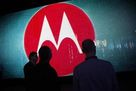 Visitors look at a video display at the Motorola booth Visitors look at a video display at the Motorola booth