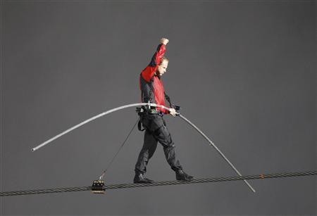 Nik Wallenda has made a historic tightrope crossing over roaring Niagara Falls on Friday night (Reuters) Nik Wallenda