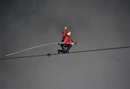 Nik Wallenda, has made a historic tightrope crossing over roaring Niagara Falls on Friday night (Reuters) Nik Wallenda