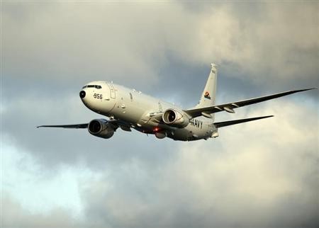A P-8A Poseidon surveillance plane conducts flyovers above the Enterprise Carrier Strike Group on February 3, 2012 in this handout photo courtesy of the U.S. Navy. REUTERS/U.S. Navy/Mass Communication Specialist 3rd Class Daniel J. Meshel/Handout P-8Is Aircrafts