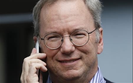 Eric Schmidt, executive chairman of Google, talks on the new yet to be released Google produced Moto X phone at the annual Allen and Co. conference in Sun Valley, Idaho Resort July 11, 2013. (Credit: REUTERS/Rick Wilking) Eric Schmidt holding a yet to be released Moto X phone