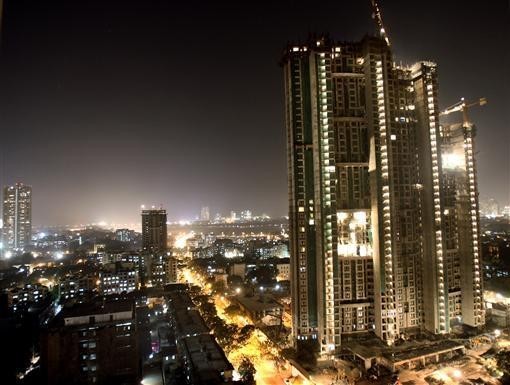 Mumbai Topped the list of World's cheapest cities of 2013. A high-rise building is lit up during construction in Mumbai December 22, 2006( Reuters)