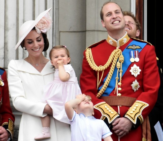 The Duke and Duchess of Cambridge along with Princess Charlotte and Princess Charlotte will visit Canada. Pictured: Catherine, Duchess of Cambridge holding Princess Charlotte, Prince George and Prince William, and Prince Harry watch a flypast as they stand on the balcony of Buckingham Palace in central London, Britain. Royal couple