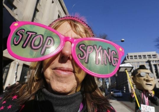 The founder of the protest group Code Pink Medea Benjamin wears large sunglasses as she protests against U.S. President Barack Obama and the NSA before his arrival at the Department of Justice