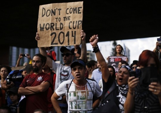 A demonstrator holds a banner during one of the many protests around Brazil's major cities in Sao Paulo Reuters