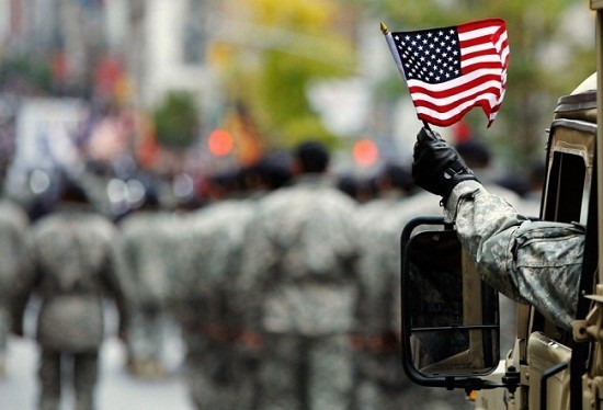 A U.S. Armed serviceman waves an American flag along 5th Avenue during the Veterans Day parade /Reuters File A U.S. Armed serviceman waves an American flag along 5th Avenue during the Veterans Day parade /Reuters File