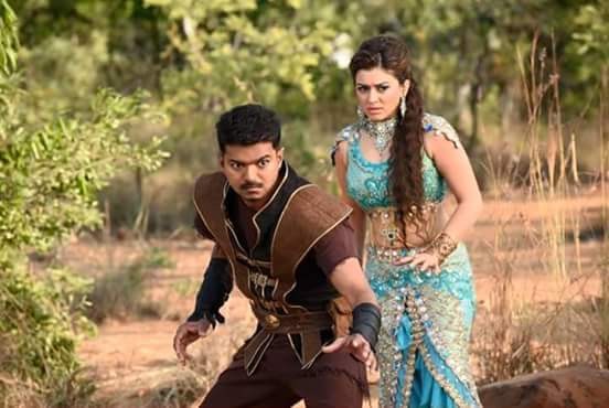 A movie still from Vijay's 'Puli' in which Hansika Motwani is also seen. Hansika Motwani with Vijay in 'Puli'
