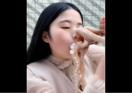 octopus stuck on woman's face