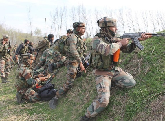 Security personnel during an encounter with militants in Pulwama district of Jammu and Kashmir on March 5, 2017. One policeman and two militants were killed in a gunfight that lasted over 15 hours. kashmir