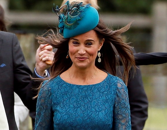 Pippa Middleton, the sister of Catherine, Duchess of Cambridge, arrives for the wedding of James Meade and Laura Marsham at St Nicholas Church in Gayton, eastern England September 14, 2013. Pippa Middleton