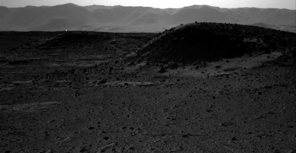 This image from NASA's Curiosity Mars rover, taken on April 3, 2014, includes a bright spot near the upper left corner. Possible explanations include a glint from a rock or a cosmic-ray hit. (NASA/JPL-Caltech)