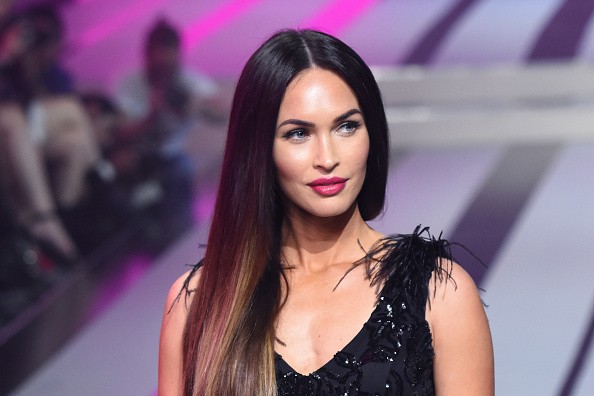 Megan Fox dazzles in a semi-sheer feathered gown at the Fashion Fest ...