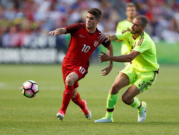 Christian Pulisic in action for the United States Men's National Soccer Team christian pulisic