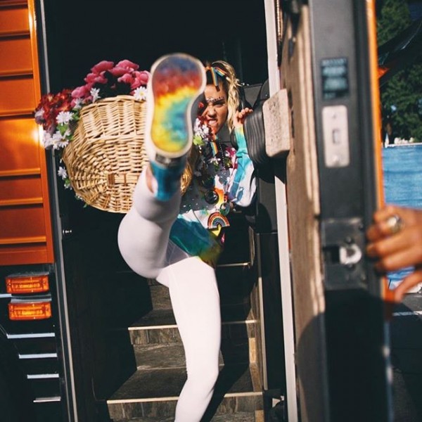 Showing her pride: Miley Cyrus performs in a colorful get-up - Photos